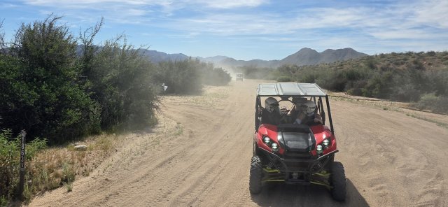 Dust in the air behind a UTV on a 360 Adventures combo tour