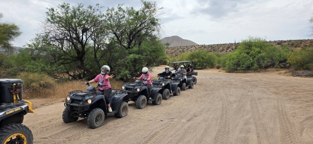 A fleet of single-rider ATVs staged for the morning tour