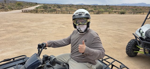 Thumbs up from a solo rider driving his own ATV near Scottsdale