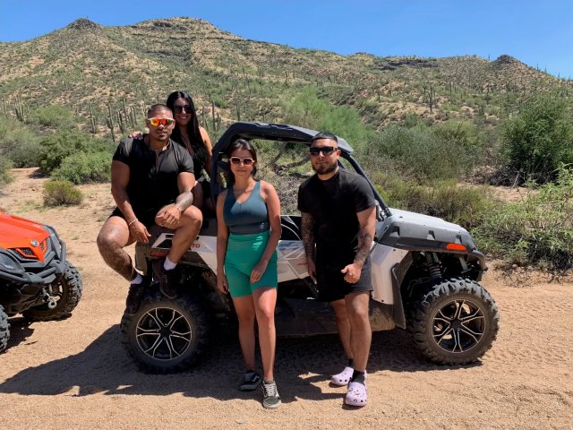 Friends with their sand buggy among the saguaros near Scottsdale